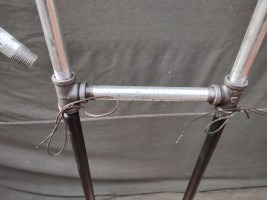 armor stand made of steel pipe and fittings.