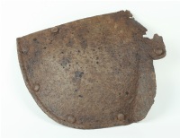 Rear part of the main plate of a Pauldron. In excavated condition.